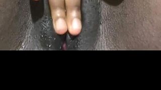 Black babe fingers huge wet pussy solo