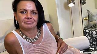 brunette milf in fishnets rips clothes and fingers her wet slit close up