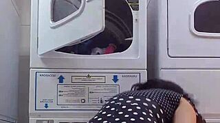 mimi flashes her bare pussy at the laundromat.