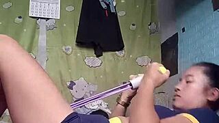 petite asian babe's tight shorts hug her workout curves.