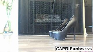 Capri spreads legs in high heels teasing pussy and big tits solo