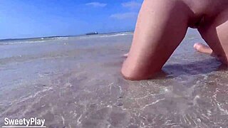 Explosive juicy piss sprays from sweet shaved pussy in beach water!