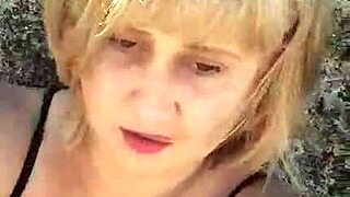 This mature blonde hits the beach flashing her huge natural tits and big pussy lips for fetish fun.