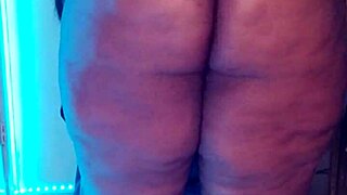 the fat ebony goddess dominatrix struts arrogantly in kinky heels dominating big ass fetish slaves