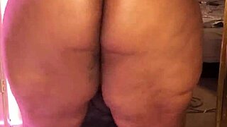 the fat ebony goddess dominatrix struts arrogantly in kinky heels dominating big ass fetish slaves