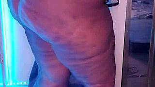 the fat ebony goddess dominatrix struts arrogantly in kinky heels dominating big ass fetish slaves