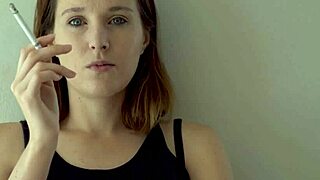 Petite brunette babe smokes hot while teasing blue eyes voyeur
