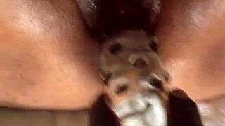 Who's stuffing this huge black pussy with that giant dildo next?