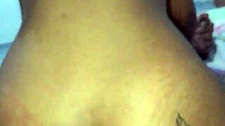 the brunette flashes her huge natural tits in fishnets before teasing her pierced nipples