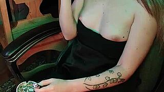 Mistress puffs cigarette slowly and sensually