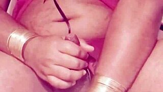 Shemale in sexy dress strokes seductively alone