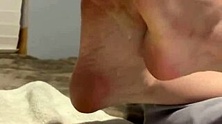 Sexy amateur milf spreads her oiled scrunched soles and toes wide