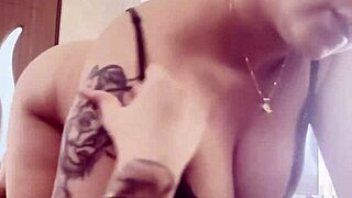 big boobs spill out from her tight black bra