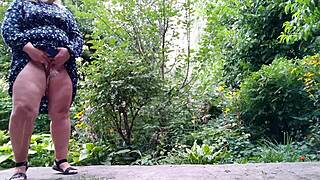 my fat chubby mature mother-in-law stands wide spreading her thick legs to pee a strong stream outdoors