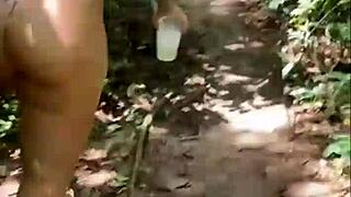 Friends follow her flashing big ass in the woods