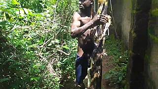 Young oiled beauty pleasures herself with plantain deep in the garden