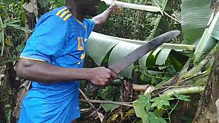 Young oiled beauty pleasures herself with plantain deep in the garden