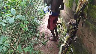 Young oiled beauty pleasures herself with plantain deep in the garden