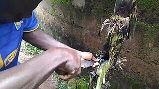 Young oiled beauty pleasures herself with plantain deep in the garden
