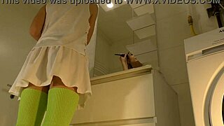 HORNY Brunette Coed Lifts Mini Skirt in Bathroom Revealing Panties Thong and Bare Pussy