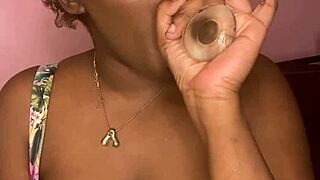Pretty ebony spreads creamy pussy with dildo