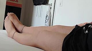 Nylon boy in nightgown and pantyhose teases with feet and legs close-up