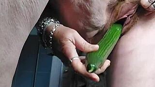 granny whore rams cucumber deep in her hairy german beaver