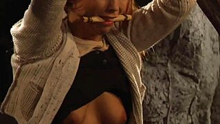 Madame whips her tied naked lesbian slave's big ass and tits until she moans in submissive orgasm