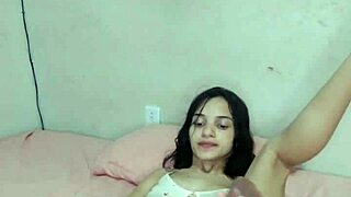 Brazilian babe crams huge dildo between massive natural tits