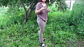 Mature milf soaks her big ass jeans with hot piss stream in public garden fetish outdoors
