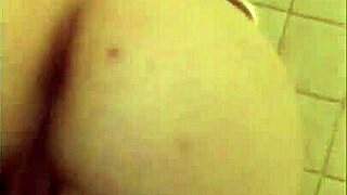 discover the allure of her wet pussy glistening in the hotel shower