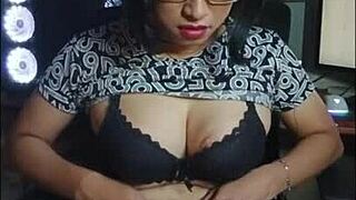 mitha sneaks a quick shemale cock stroke in her office