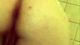 discover the allure of her wet pussy glistening in the hotel shower