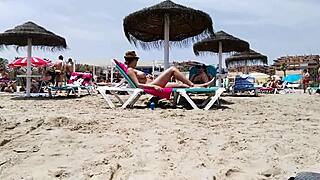 Brunette's huge tits bounce wildly on the beach