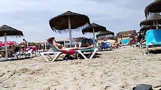 Brunette's huge tits bounce wildly on the beach