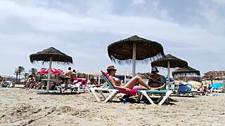 Brunette's huge tits bounce wildly on the beach