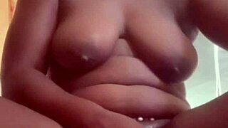 i get so turned on watching this sexy african girl touch her huge tits and pussy