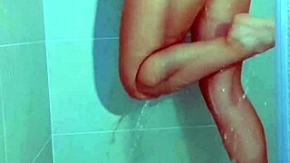 Hey, watch this college Brazilian beauty tease her wet thong pussy in steamy shower