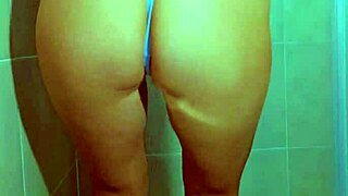 Hey, watch this college Brazilian beauty tease her wet thong pussy in steamy shower