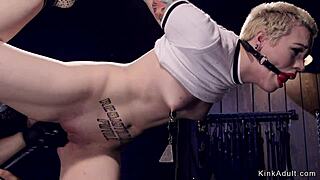 Short hair blonde gags on cock in tight device bondage