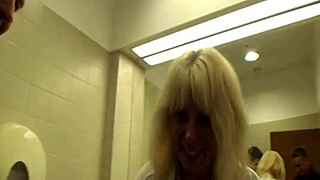 blonde milf delivers blowjob cumshot in public mall restroom