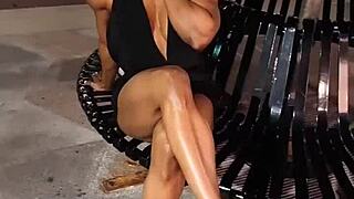 Erotic female bodybuilder babe flexes muscles in hot sensual pose session