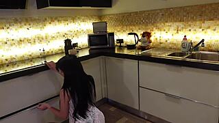 Hot brunette babe shows pussy and big ass in kitchen