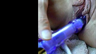 Slow mo close up of wife stuffing her pussy