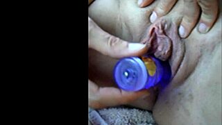 Slow mo close up of wife stuffing her pussy