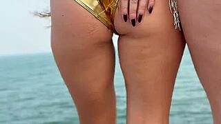Dancing and teasing in sexy mini bikini at public