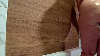 Bathroom camera watches mature wife shower