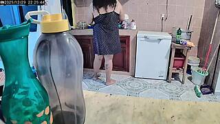 curvy woman cooking dinner in her kitchen at home today