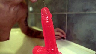 sexy bitch passionately masturbates huge rubber cock wet vagina in the bathroom on camera