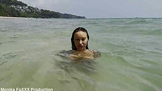 Monika fox walks beach in white panties and swims